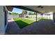 The backyard has brick patio, a pergola, artificial grass, and updated landscaping at 5259 E Karen Dr, Scottsdale, AZ 85254