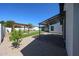Spacious backyard featuring a covered patio and pergola with beautiful landscaping at 5259 E Karen Dr, Scottsdale, AZ 85254