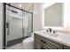 Modern bathroom featuring glass-enclosed shower, illuminated mirror, and sleek fixtures at 5259 E Karen Dr, Scottsdale, AZ 85254