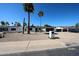 Charming home with desert landscaping, dark trim, a two-car garage, and solar panels at 5259 E Karen Dr, Scottsdale, AZ 85254