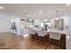 Spacious kitchen featuring marble countertops, white cabinets, and a large island with bar seating at 5259 E Karen Dr, Scottsdale, AZ 85254