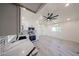 Open-concept kitchen featuring a stylish backsplash, stainless steel appliances, and bright, white cabinetry at 5259 E Karen Dr, Scottsdale, AZ 85254