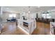 Elegant kitchen with a marble island, stainless steel microwave, and open layout, designed for modern living at 5259 E Karen Dr, Scottsdale, AZ 85254