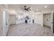 Bright space with vaulted ceilings, modern fan, recessed lighting, open kitchen and access to outdoor spaces at 5259 E Karen Dr, Scottsdale, AZ 85254
