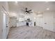 Airy floorplan with wood look flooring, recessed lighting, access to bathroom, kitchen, and outdoor spaces at 5259 E Karen Dr, Scottsdale, AZ 85254