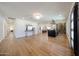 Spacious living room with a bar and a dining area showcasing an open-concept design and light hardwood floors at 5259 E Karen Dr, Scottsdale, AZ 85254