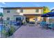 Beautiful backyard with a covered patio, a pool with black fence, and an outdoor dining area at 5930 E Fountain St, Mesa, AZ 85205