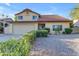 Charming two-story home with a well-maintained front yard featuring desert landscaping and a two-car garage at 5930 E Fountain St, Mesa, AZ 85205