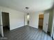 Bedroom with wood laminate flooring, two entrances, and lots of natural light at 6565 N 19Th Ave # 38, Phoenix, AZ 85015