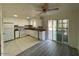Updated kitchen features white cabinets, tile flooring, and easy access to the outdoor patio area at 6565 N 19Th Ave # 38, Phoenix, AZ 85015