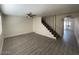 Inviting living room featuring modern flooring, a ceiling fan, and a staircase at 6565 N 19Th Ave # 38, Phoenix, AZ 85015