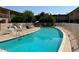 Community pool surrounded by seating, perfect for relaxation and social gatherings at 6565 N 19Th Ave # 38, Phoenix, AZ 85015