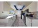 Kitchen featuring white cabinetry, stainless steel appliances, tile floors, and modern countertops at 7132 W Vermont Ave, Glendale, AZ 85303