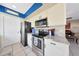 Bright kitchen featuring stainless appliances, granite countertops, tile floors, and white cabinetry at 7132 W Vermont Ave, Glendale, AZ 85303
