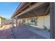 Covered backyard patio area with an outdoor dining table at 7132 W Vermont Ave, Glendale, AZ 85303