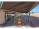 Covered patio features an outdoor dining set with overhead shelter at 7132 W Vermont Ave, Glendale, AZ 85303