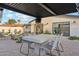 Outdoor patio featuring a dining area under a shaded pergola, with seating, perfect for alfresco meals and entertaining at 7432 E Holly St, Scottsdale, AZ 85257