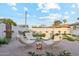 Backyard with comfortable seating area, beautiful landscaping, providing an excellent space for gathering and enjoying the outdoors at 7432 E Holly St, Scottsdale, AZ 85257