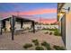 Beautiful backyard with a covered patio, manicured landscaping, and cozy seating area for outdoor relaxation and entertaining at 7432 E Holly St, Scottsdale, AZ 85257