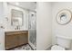 Bathroom with stylish tile flooring, modern vanity, and glass-enclosed shower at 7432 E Holly St, Scottsdale, AZ 85257