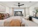 Bedroom with a ceiling fan, sliding glass door leading to the backyard, and neutral colors at 7432 E Holly St, Scottsdale, AZ 85257