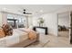 Bright, spacious bedroom with modern decor and sliding glass doors to the backyard at 7432 E Holly St, Scottsdale, AZ 85257