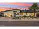 Home featuring a well-manicured front yard, stylish landscaping, and a welcoming entrance, creating a charming curb appeal at 7432 E Holly St, Scottsdale, AZ 85257