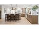 Bright kitchen featuring a large island with seating, modern appliances, and stylish cabinets at 7432 E Holly St, Scottsdale, AZ 85257