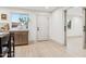 Bright kitchenette space with modern cabinetry, marble countertops and a seamless transition to the adjacent dining area at 7432 E Holly St, Scottsdale, AZ 85257