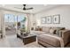Inviting living room with a cozy sectional sofa, stylish decor, and sliding glass doors offering backyard views at 7432 E Holly St, Scottsdale, AZ 85257