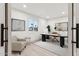 Bright home office featuring modern decor, a stylish desk, an office chair, and a large window at 7432 E Holly St, Scottsdale, AZ 85257