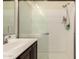 Shower featuring an updated showerhead with a sleek design and shower supplies on a shelf at 7726 E Baseline Rd # 154, Mesa, AZ 85209