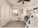 Bright bedroom featuring a vanity with a mirror and stool, a bunk bed, and a built-in closet at 7726 E Baseline Rd # 154, Mesa, AZ 85209
