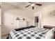 Bedroom featuring a ceiling fan, and dresser, offering a comfortable space at 7726 E Baseline Rd # 154, Mesa, AZ 85209
