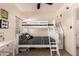 Bedroom featuring a vanity with a mirror and stool, a bunk bed with black and white striped linens at 7726 E Baseline Rd # 154, Mesa, AZ 85209