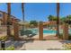 Inviting community pool area featuring lounge chairs and well maintained landscaping in a secure gated setting at 7726 E Baseline Rd # 154, Mesa, AZ 85209