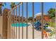 Beautiful community pool showcasing seating with table, landscaping, and refreshing water at 7726 E Baseline Rd # 154, Mesa, AZ 85209
