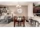 Open layout with dining table, kitchen bar, and inviting decor elements at 7726 E Baseline Rd # 154, Mesa, AZ 85209