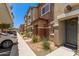 Beautiful townhome exterior with stone accents and well-maintained landscaping at 7726 E Baseline Rd # 154, Mesa, AZ 85209