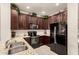 Kitchen with granite counters, stainless steel appliances, and ample cabinet space at 7726 E Baseline Rd # 154, Mesa, AZ 85209