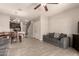 Open concept living space with tile floors, dining area, and comfortable gray couches at 7726 E Baseline Rd # 154, Mesa, AZ 85209