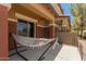 Relaxing outdoor patio area with a comfortable hammock at 7726 E Baseline Rd # 154, Mesa, AZ 85209