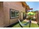 This backyard features a hammock, artificial turf, and patio seating, making it perfect for relaxing outdoors at 8532 E Portland St, Scottsdale, AZ 85257