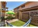 Relaxing backyard oasis with artificial turf, outdoor seating, and decorative wall art at 8532 E Portland St, Scottsdale, AZ 85257