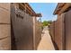 View of property entrance featuring a gated courtyard and walkway at 8532 E Portland St, Scottsdale, AZ 85257