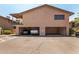 A covered garage area with parking for two cars and access to the residential units above at 8532 E Portland St, Scottsdale, AZ 85257