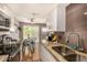 Updated kitchen with granite countertops, stainless steel appliances, and an open layout at 8532 E Portland St, Scottsdale, AZ 85257