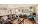 Inviting living room features stylish decor, a cozy couch, and plenty of natural light at 8532 E Portland St, Scottsdale, AZ 85257