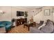Charming living area with TV, modern furniture, and staircase access to the upper level at 8532 E Portland St, Scottsdale, AZ 85257