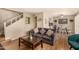 Open-concept living space includes a cozy lounge area and dining space with stylish decor at 8532 E Portland St, Scottsdale, AZ 85257